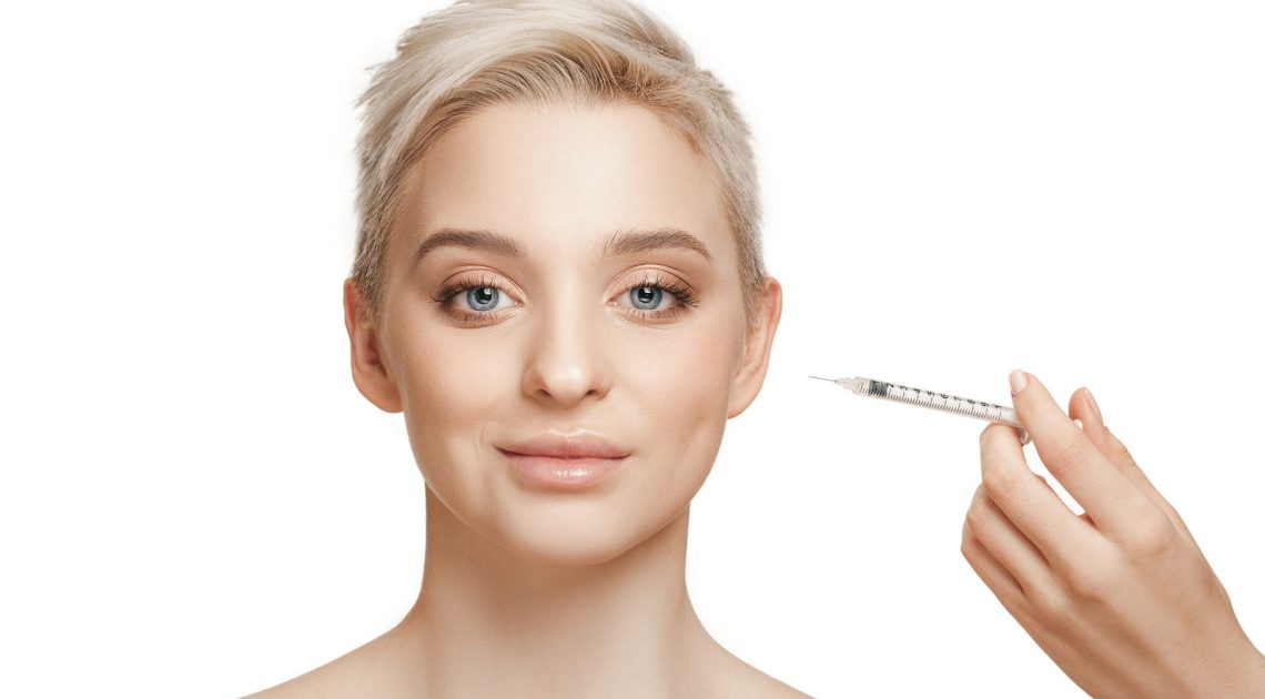 people-lips-cosmetology-plastic-surgery-beauty-concept-beautiful-young-woman-face-hand-with-syringe-making-injection (2)