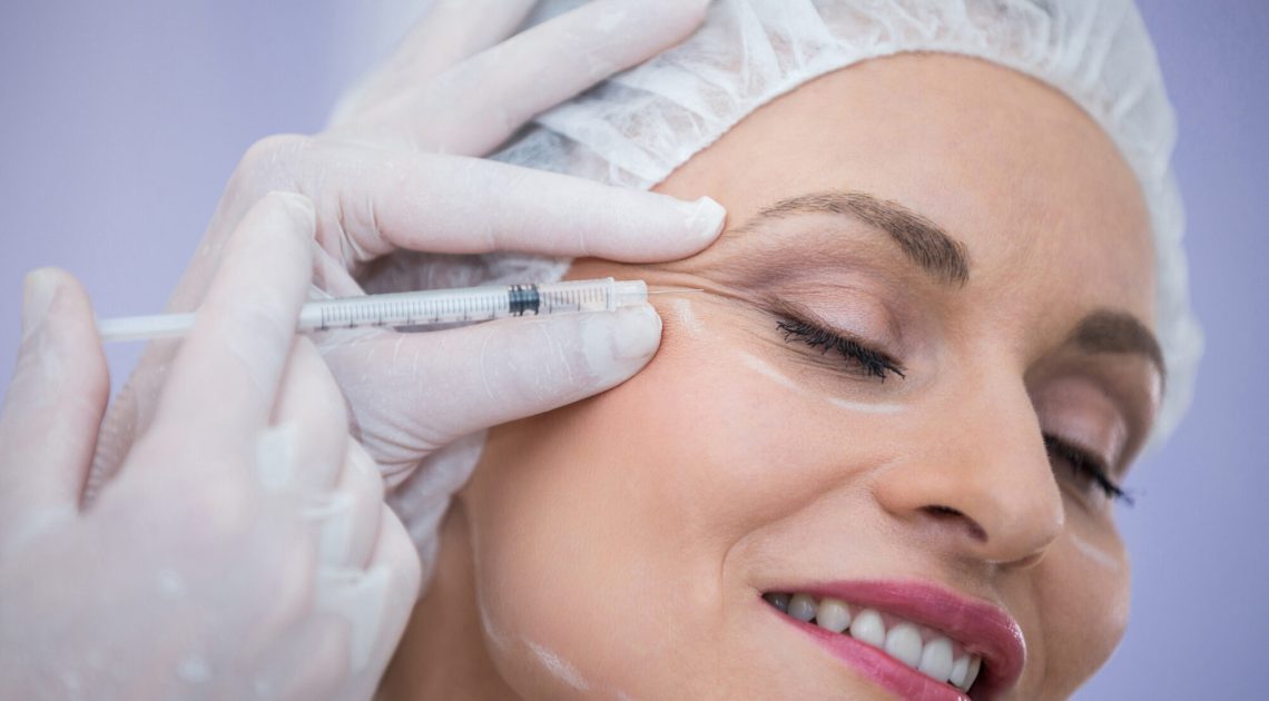 woman-with-marked-face-receiving-botox-injection